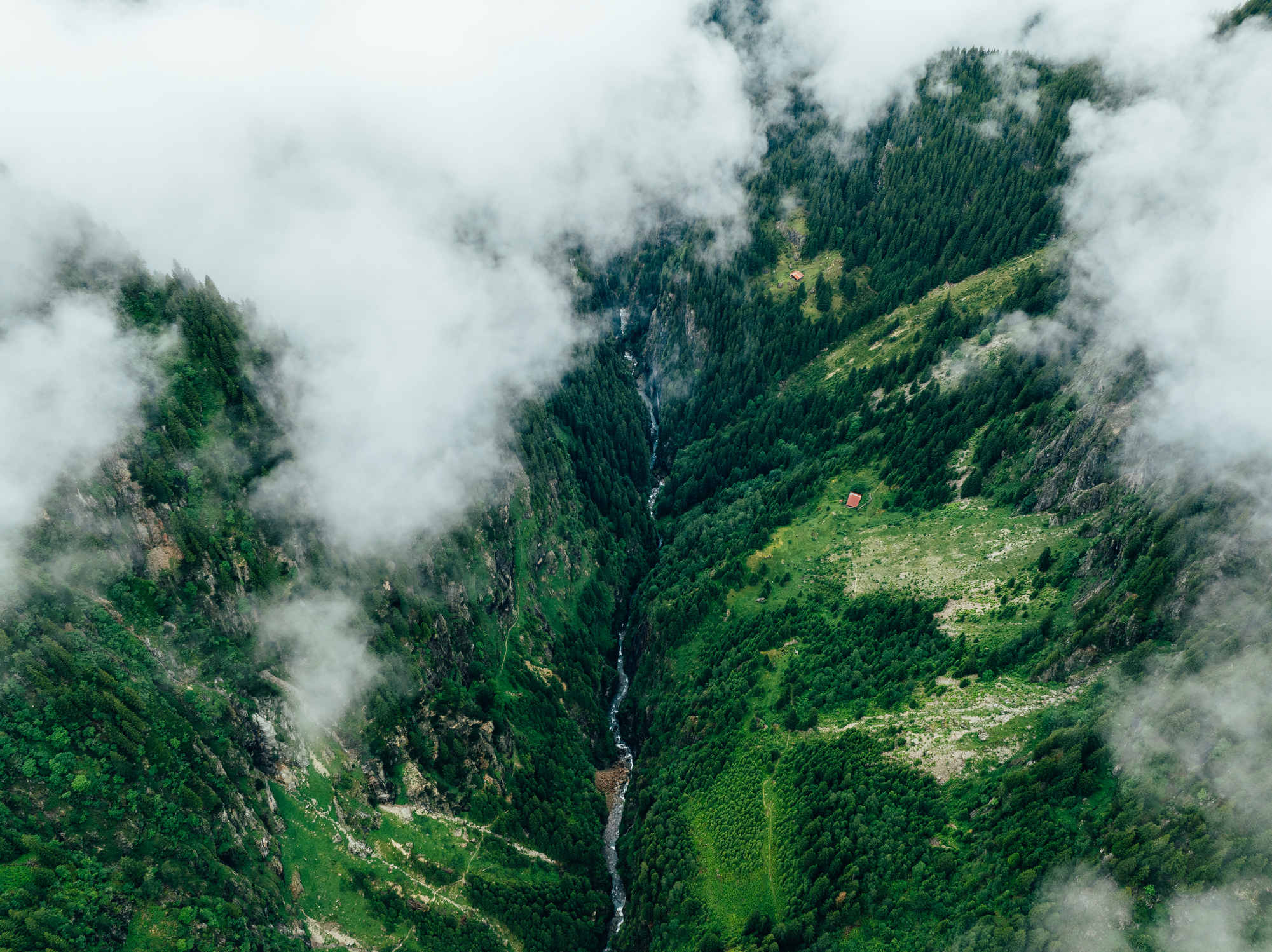 Switzerland stream in the fog from a drone