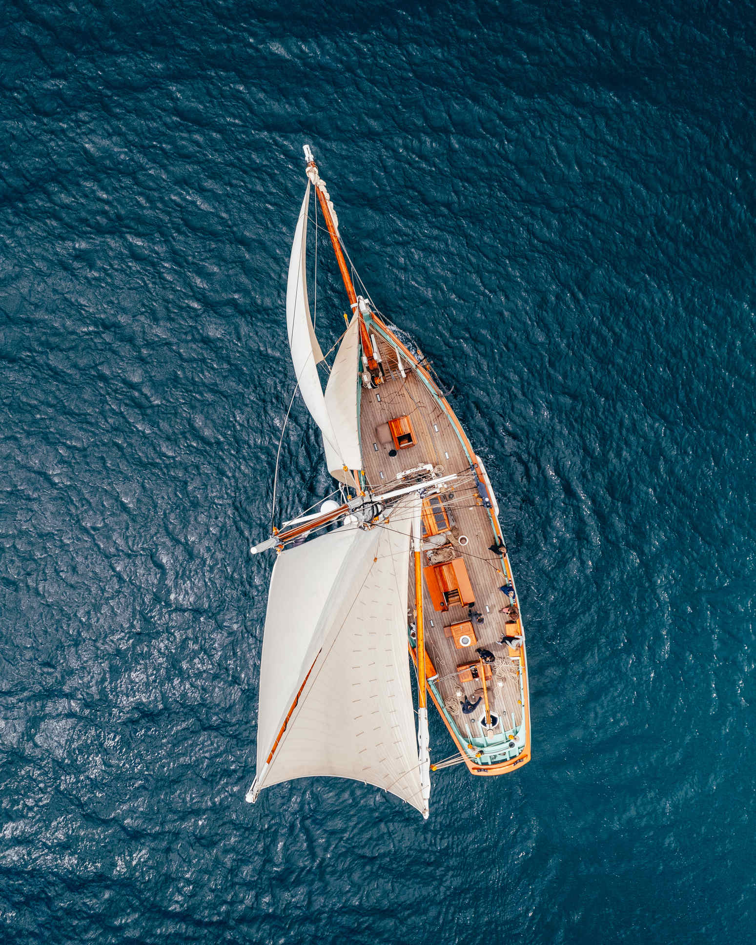 Top down aerial view of a tall ship sailing