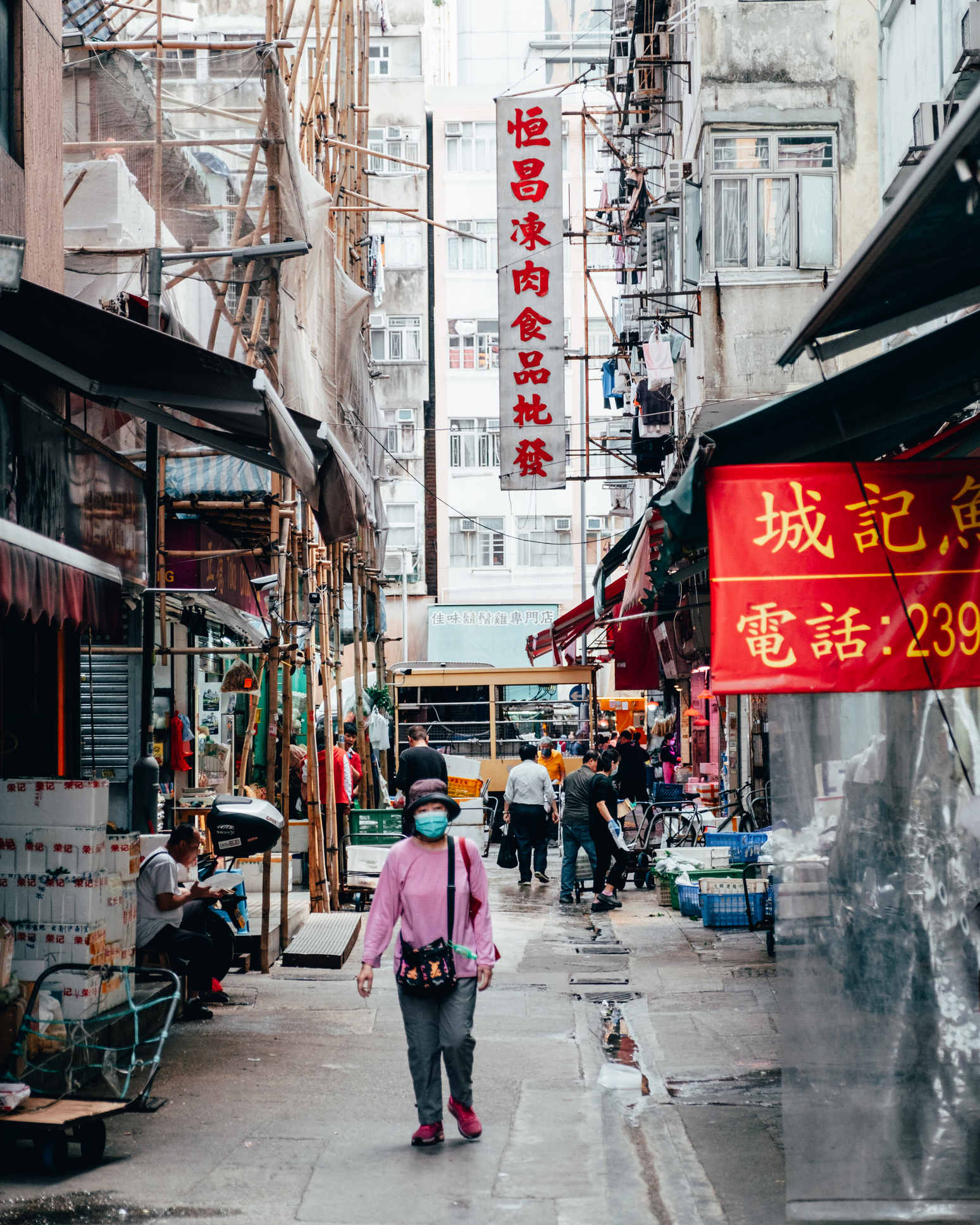 Woman walking down street in Hong Kong