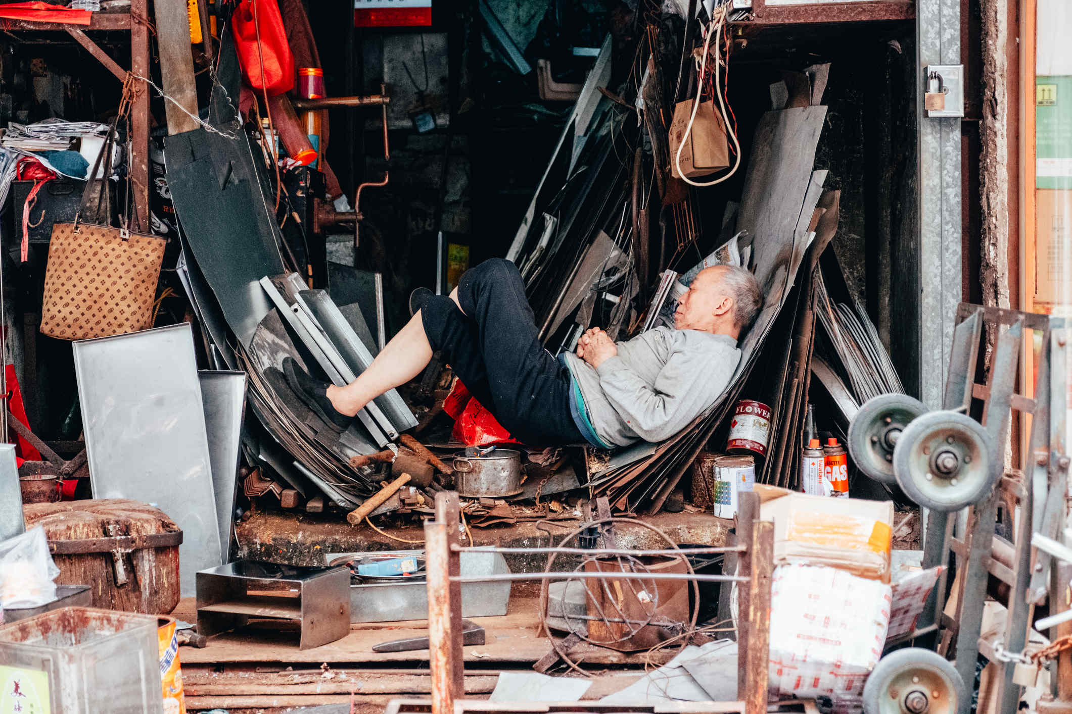 Man sleeping on the streets in Hong Kong