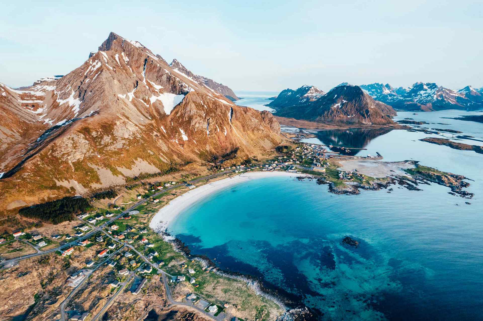 colourful beach in Norway with mountains