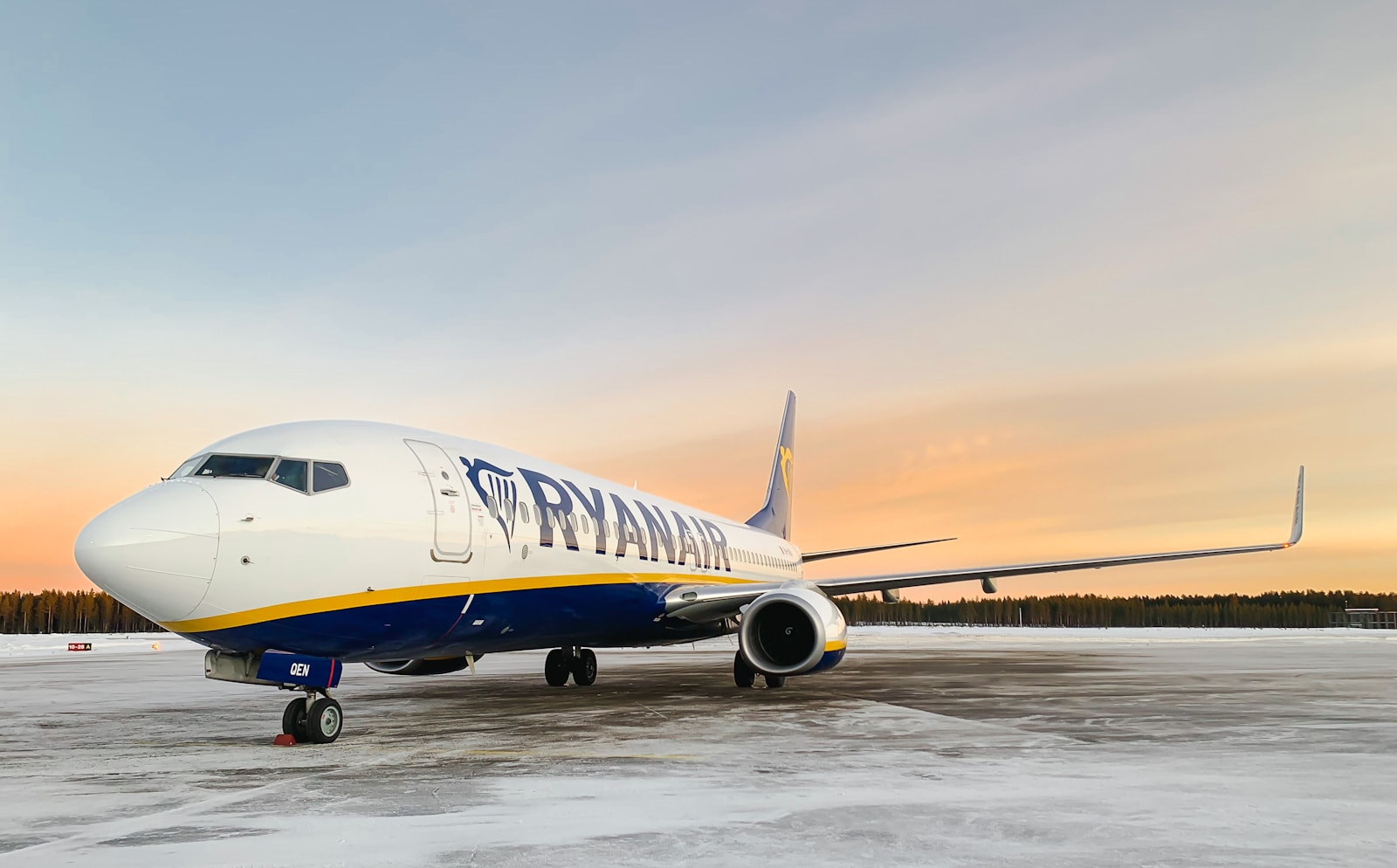 a large jetliner sitting on top of an airport tarmac