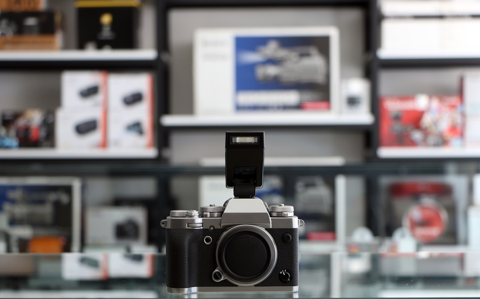 a camera sitting on top of a glass table