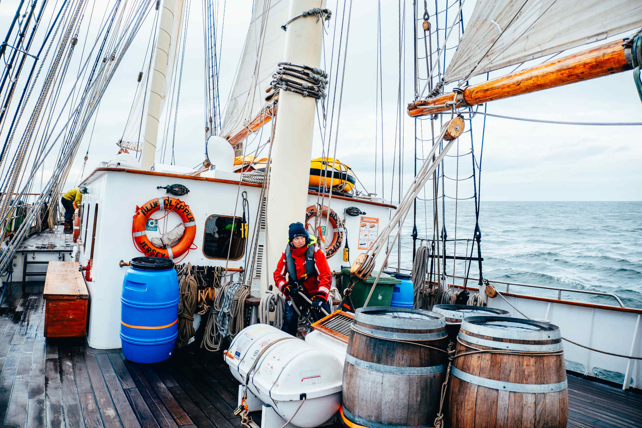 Woman on tall ship at sea