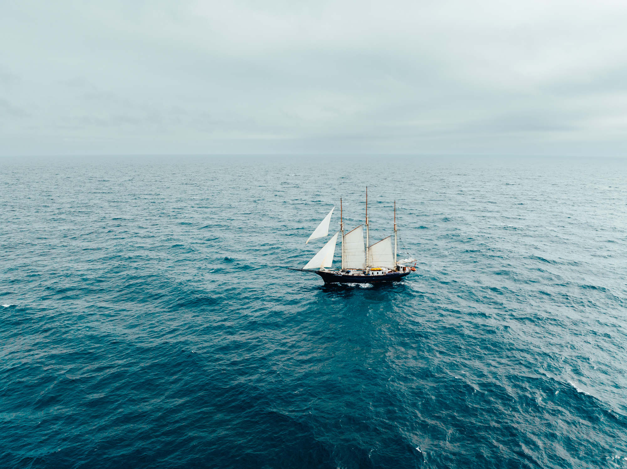 Blue clipper sailing from a drone