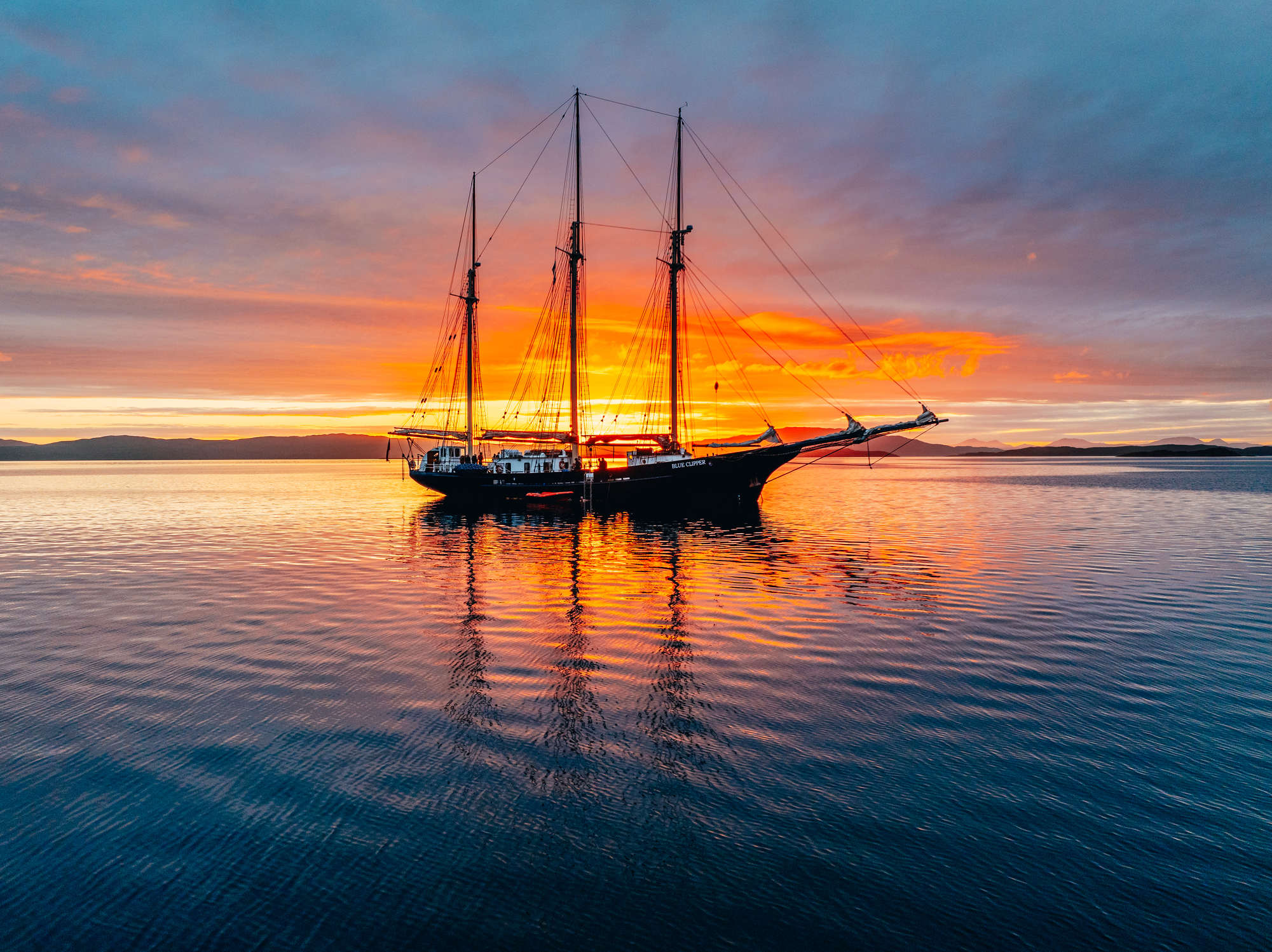 Tall ship blue clipper sunset